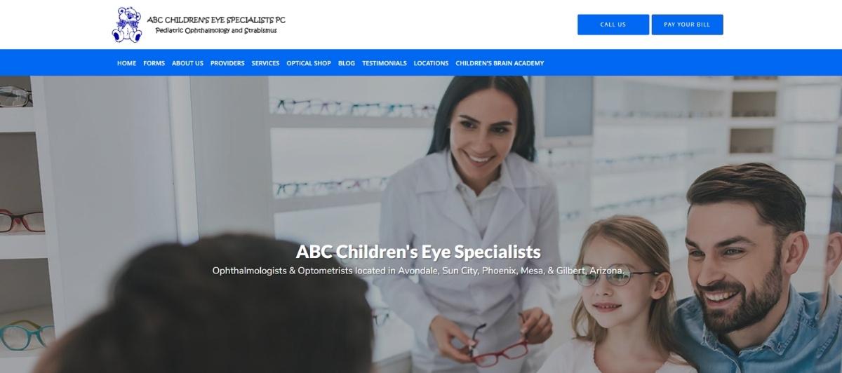 Hero banner: a female doctor with glasses assists a child and parents in an eye clinic; overlay reads 'ABC Children's Eye Specialists'.