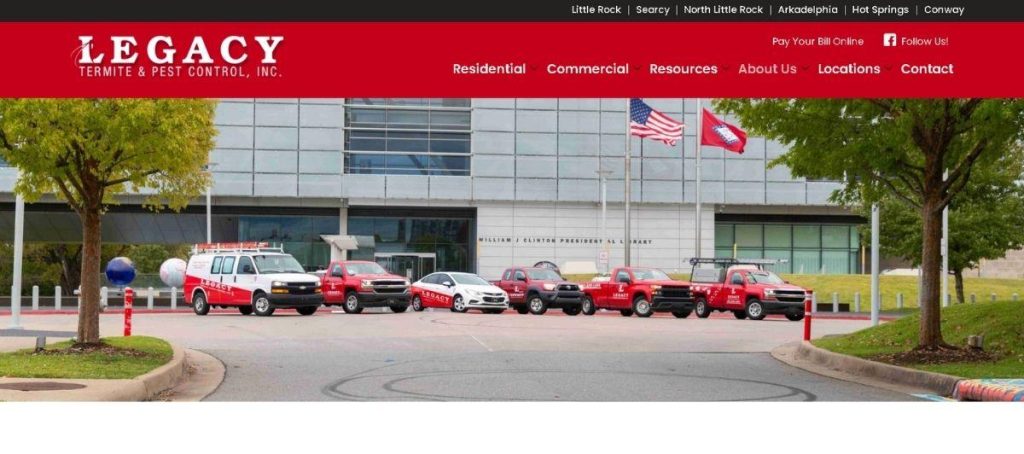 Row of red Legacy pest control vehicles parked in front of a modern office building with trees and flags in the background (header visible).