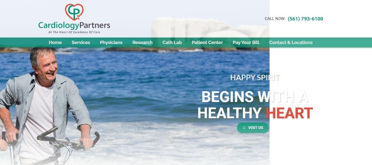 Hero image of a smiling man biking on a sunny beach with the ocean behind, for Cardiology Partners' heart health message 'Begins with a healthy heart'.
