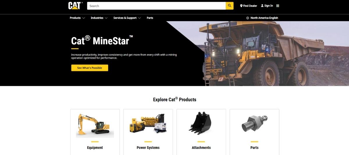 Cat MineStar hero banner featuring a mining dump truck and bold branding with a search bar and navigation at the top (informational header).