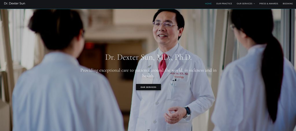 Doctor in a white coat speaks with two medical staff in a hospital corridor, centered on the hero banner promoting patient care.
