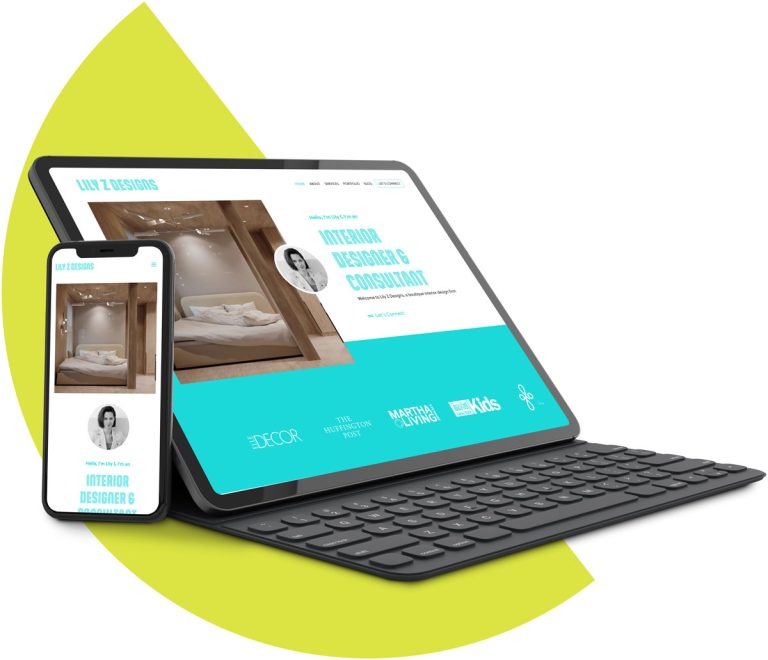 Smartphone leaning against tablet with keyboard with mockup of websites