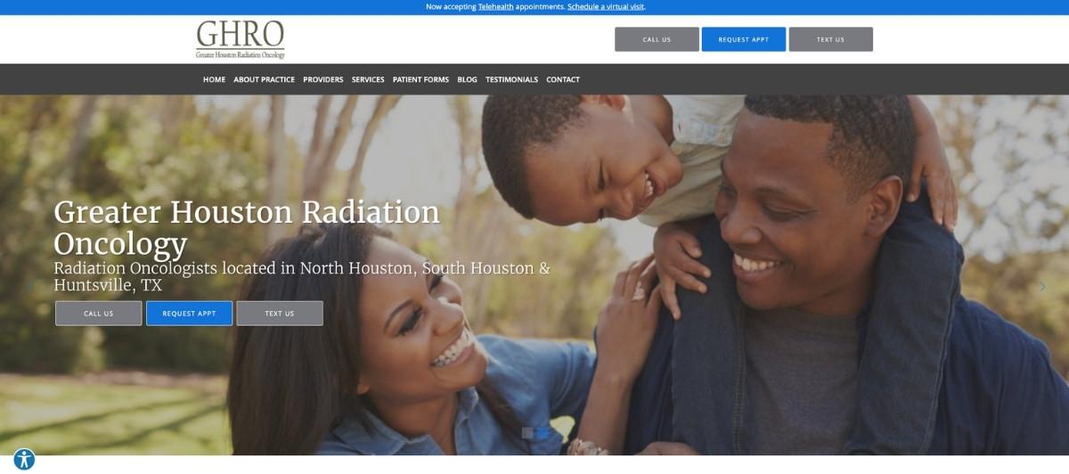 Smiling African American family outdoors; man on shoulders with child, woman beside, conveying warmth and support for a cancer care clinic's hero image