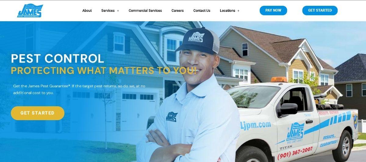 Smiling pest control technician in a uniform stands in front of a suburban house with a branded service truck nearby
