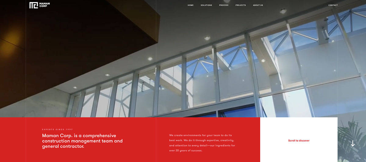 Hero banner for Maman Corp: modern glass atrium with red and white information panels at the bottom.