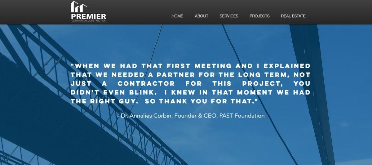 Homepage hero showing Premier Commercial Construction logo and navigation, with a blue steel-structure background and a white testimonial quote by Dr. Annalies Corbin (Founder & CEO, PAST Foundation).