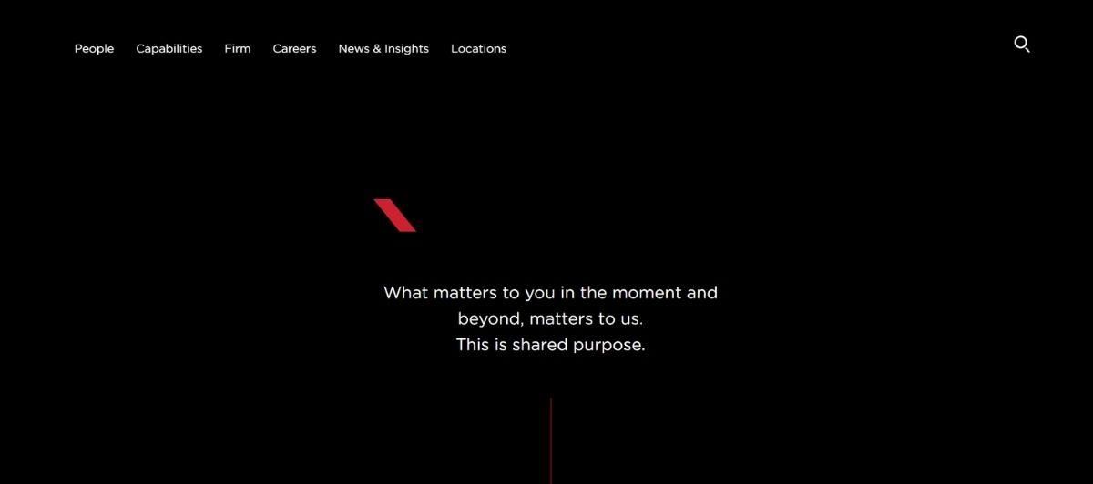 Small red diagonal logo on a black hero background with a centered white slogan about shared purpose: “What matters to you in the moment and beyond, matters to us. This is shared purpose.”