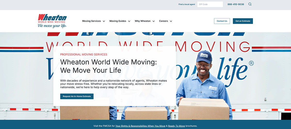 Moving truck with a smiling worker holding boxes in front of a promotional white panel for Wheaton World Wide Moving.