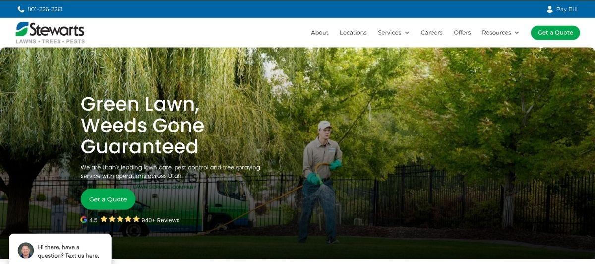 Hero banner showing a lawn care technician spraying a green lawn with a truck in the background; headline reads 'Green Lawn, Weeds Gone Guaranteed' with a green Get a Quote button nearby.