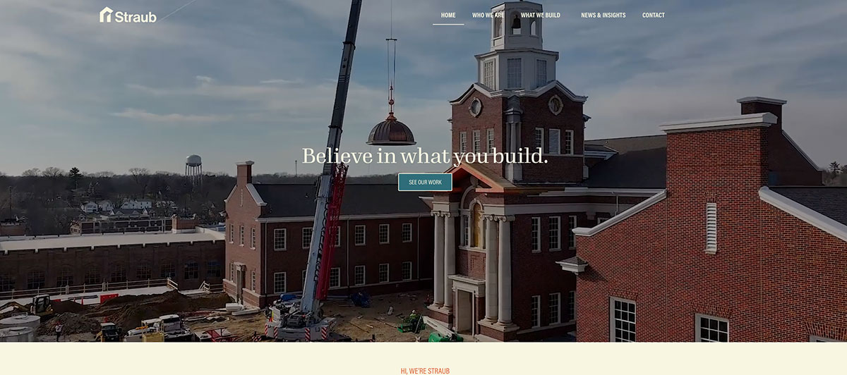 Hero image of a brick campus building under construction with a crane and the slogan 'Believe in what you build.'