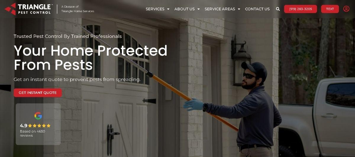 Pest control technician spraying the doorway of a suburban home to protect it from pests cast in a hazy exterior light.