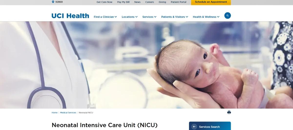 Newborn baby cradled in hands in a hospital NICU setting, with a doctor’s stethoscope nearby