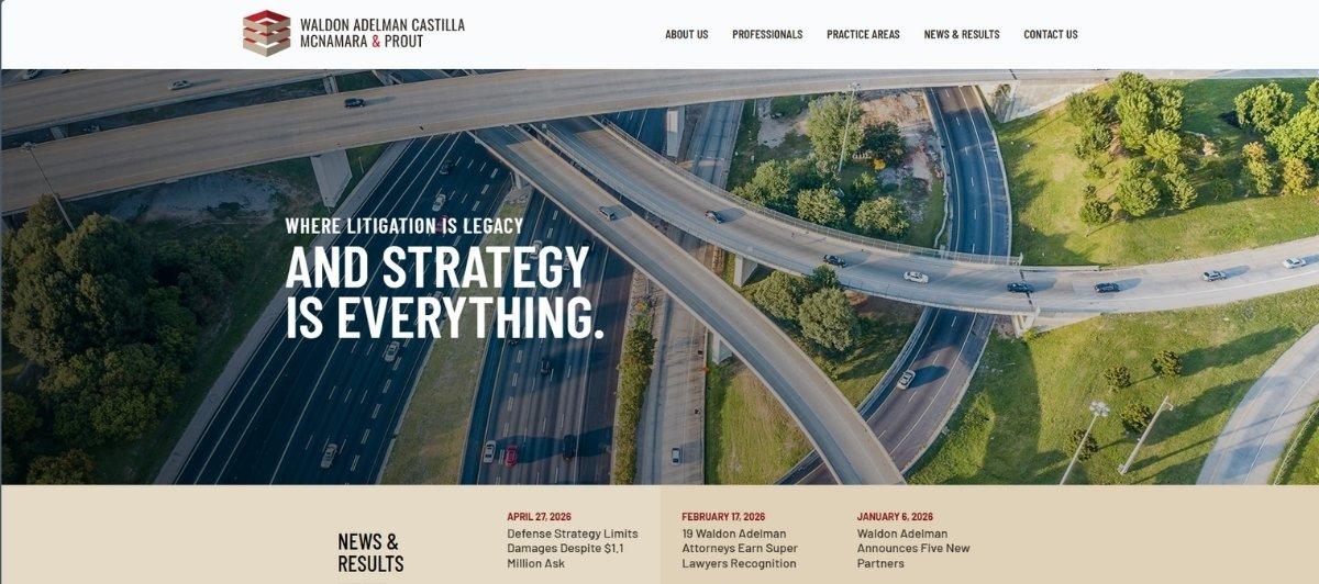 Aerial view of a multi‑level highway interchange used as the hero image on a law firm website, with the slogan 'Where litigation is legacy and strategy is everything.'