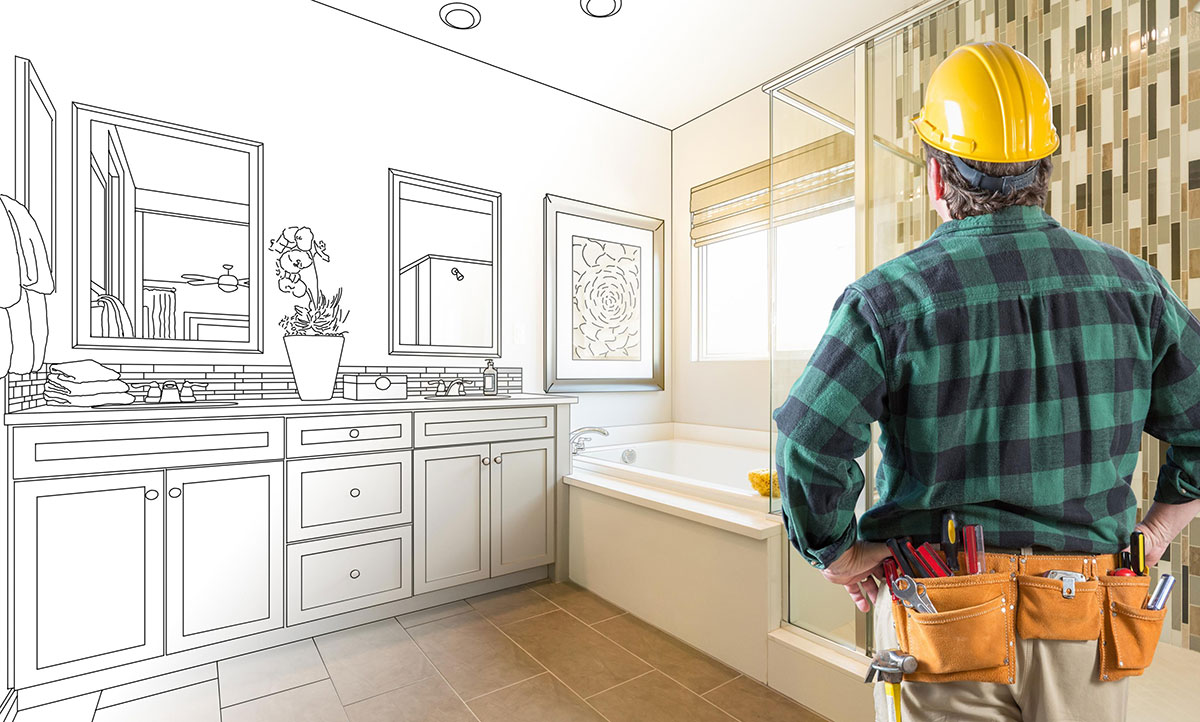 construction worker envisioning the space in a bathroom