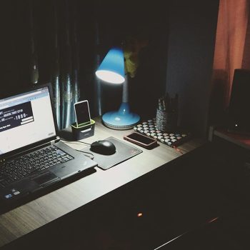 dark room with laptop on desk