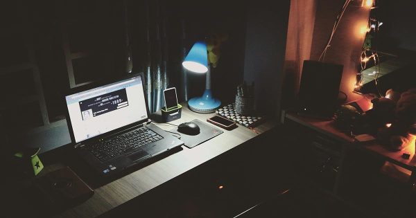 dark room with laptop on desk