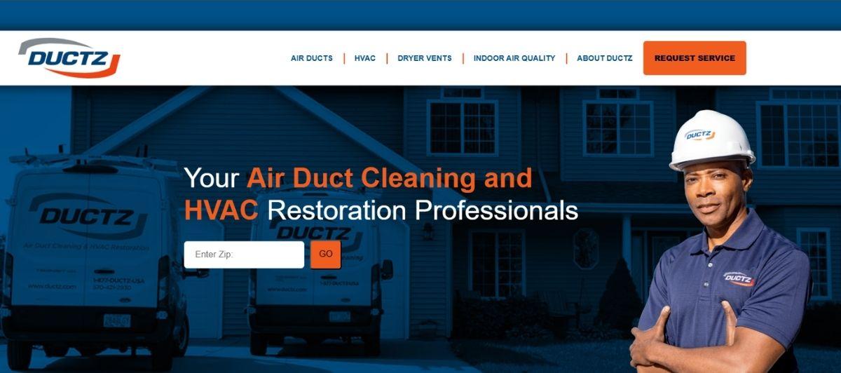 DuctZ hero banner: technician in hard hat beside service vans in front of a house with the headline about air duct cleaning and HVAC restoration, plus a ZIP code search field and GO button.